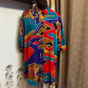 Vintage 1980’s Caliche vibrant abstract multicolor short sleeve shirt. Size 16W